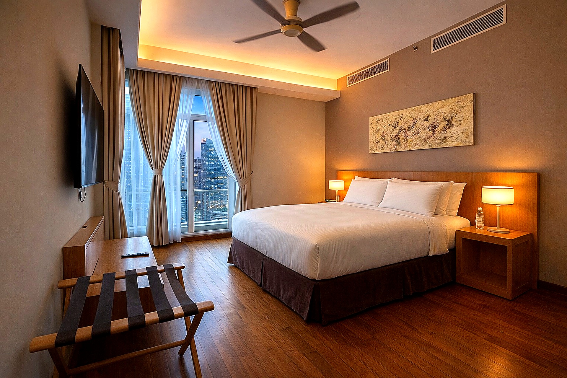 Bedroom with evening city view
